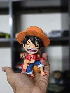 One Piece Monkey D. Luffy Sitting Figure – Red Cardigan Chibi Statue with Little Monkey